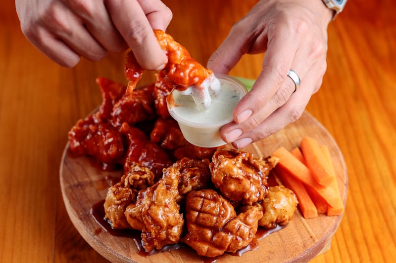 Spicy Sriracha Tenders coated in sriracha glaze